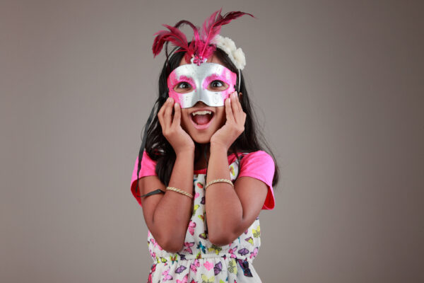 Portrait,Of,Girl,Holds,A,Samba,Mask,On,Face